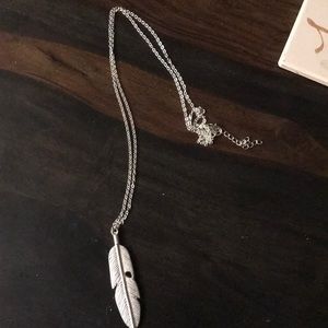 Silver feather necklace.